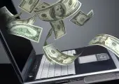 dollar bills and a laptop