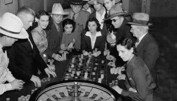 an old image of people playing roulette in  Las Vegas casino